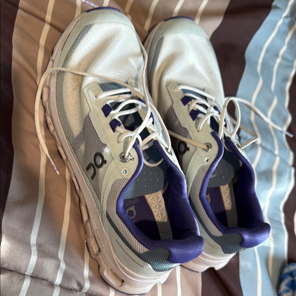 On Running White and Purple Athletic Shoes